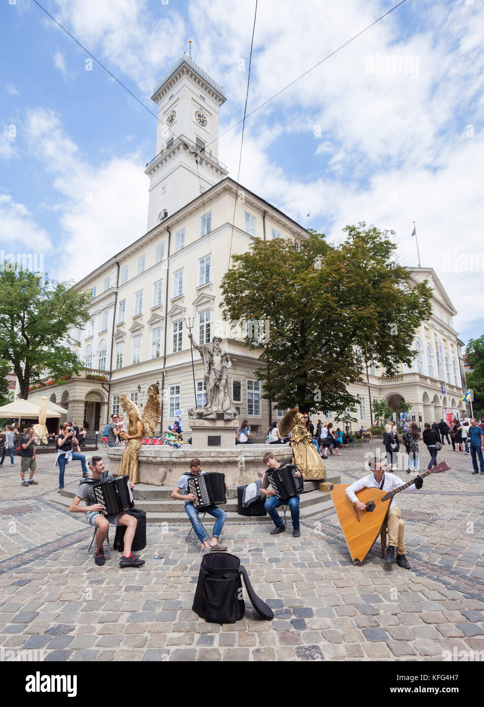 LVIV, UKRAINE - JUNE 3: Street musicians perform Bach on accordions and a balalaika contrabass in Rynok Square, Lviv, Ukraine on 3 June 2017. Stock Photo