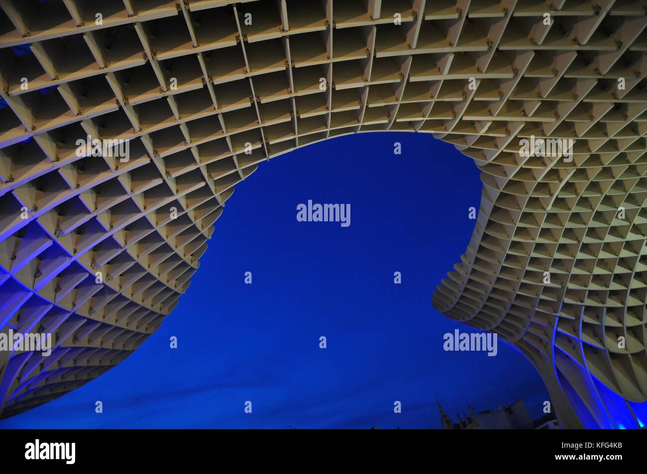 Metropol Parasol, in Seville, Spain. Abstract of Giant wooden structure at dusk creating blue background image of your imagination. Stock Photo