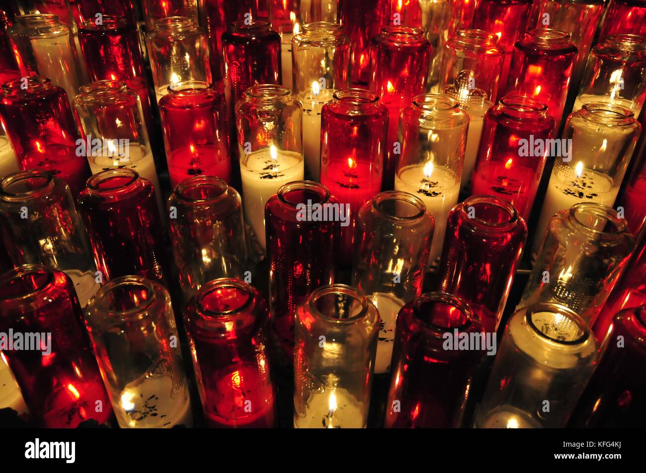 Red glass candle cylinder with cross design 