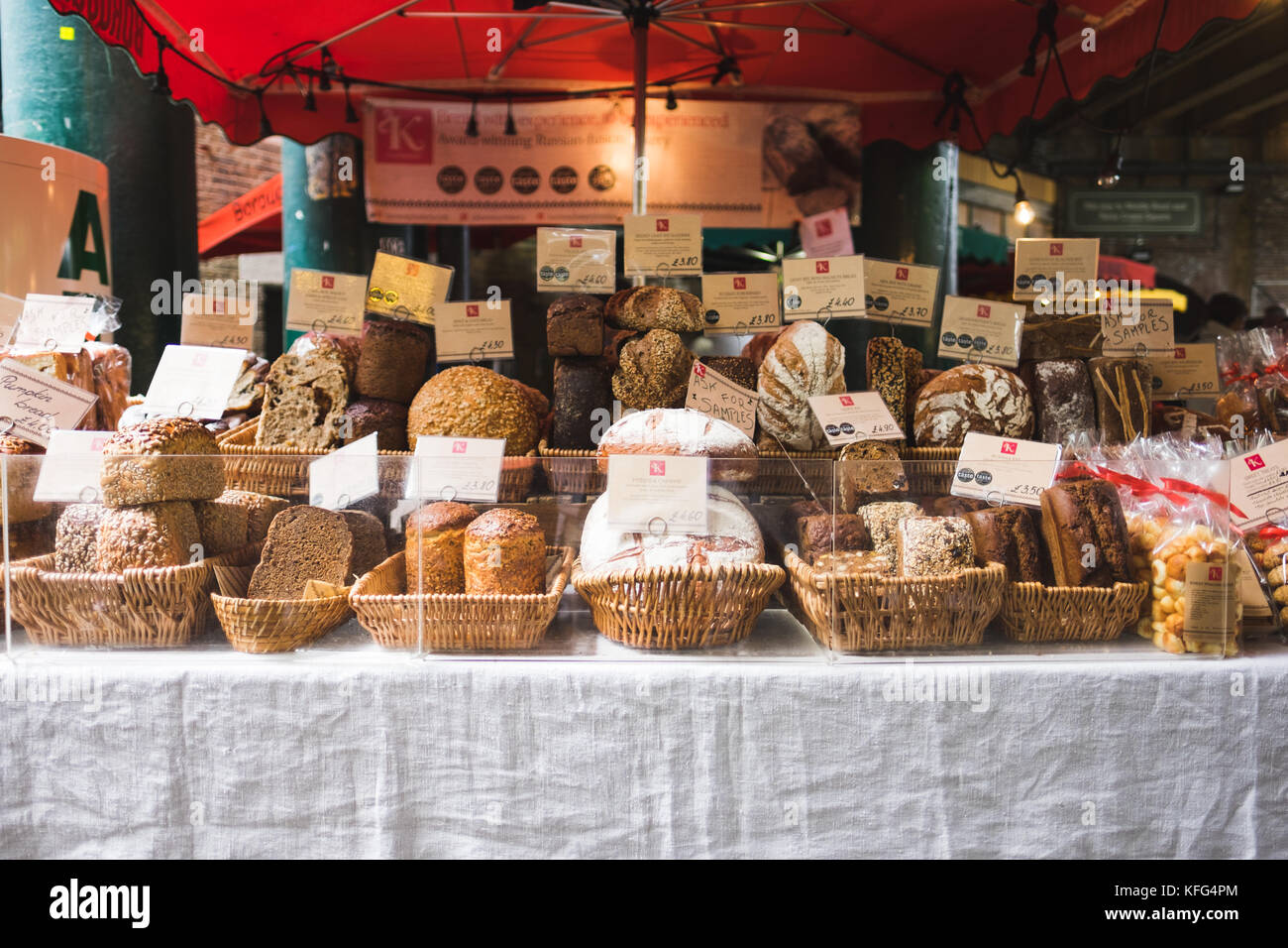 A baker selling bread displays his produce Stock Photo