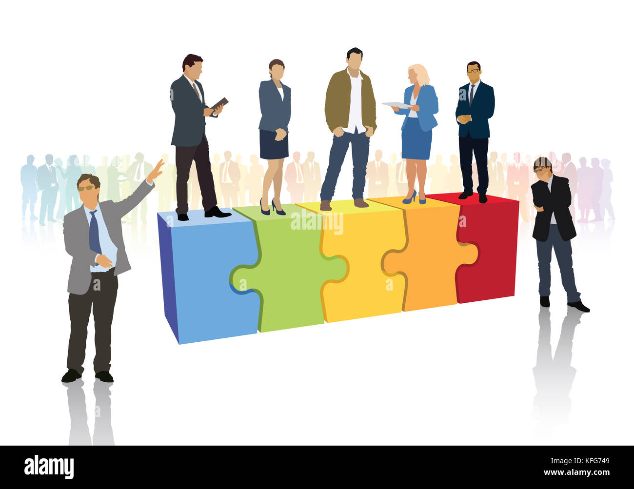 Successful business team is standing on pieces of jigsaw puzzle in front of large crowd of businesspeople. Stock Photo