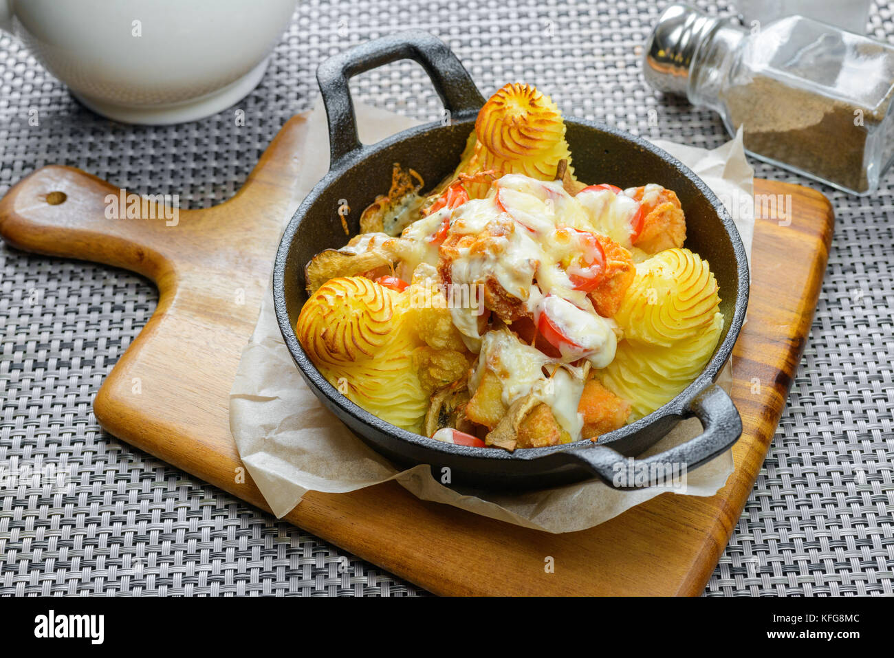 Mashed potatoes with meat and vegetables in frying pan Stock Photo
