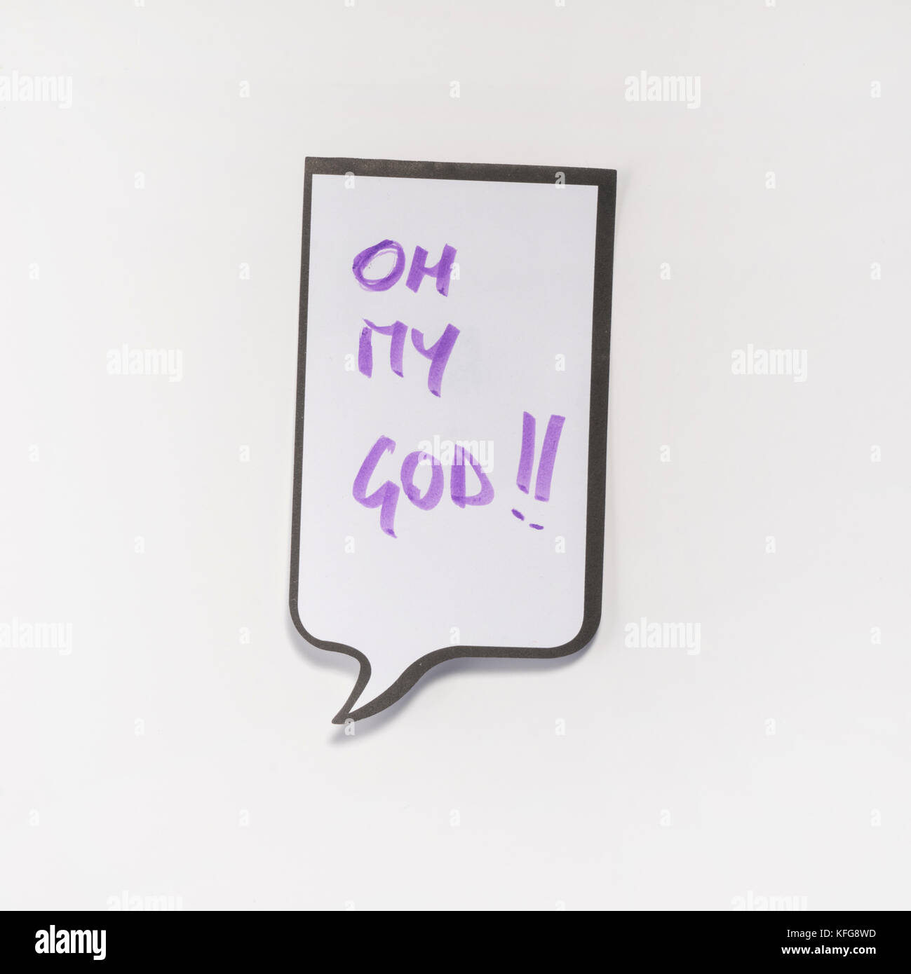 a white memo pad with the shape of a comic with the inscription 'oh my God' Stock Photo