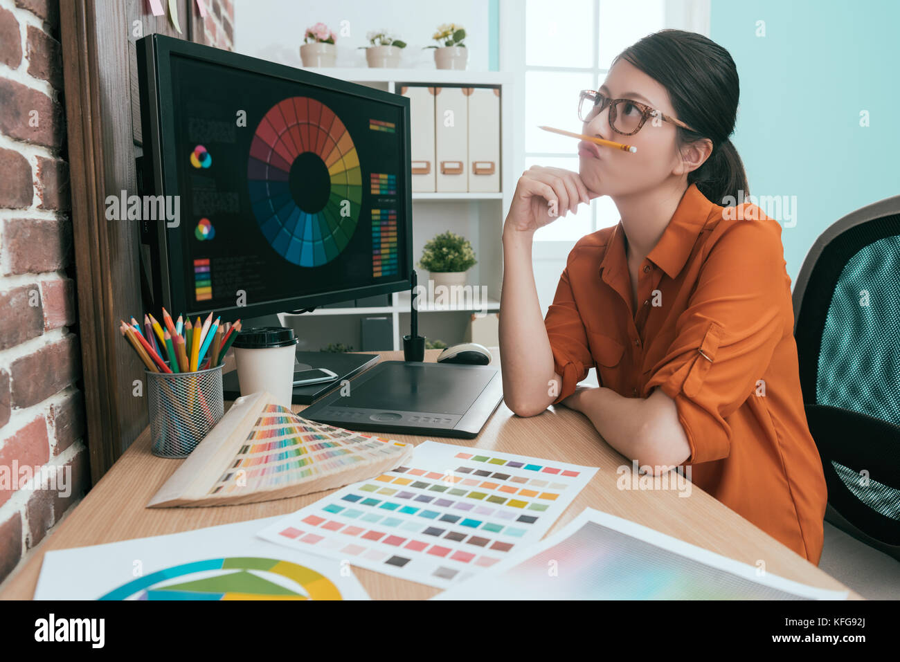 Woman thinking with pen pencil hi-res stock photography and images - Alamy