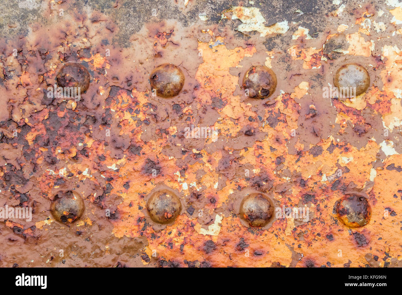 A rusty steel girder with rivets on sea defences, England, UK Stock Photo