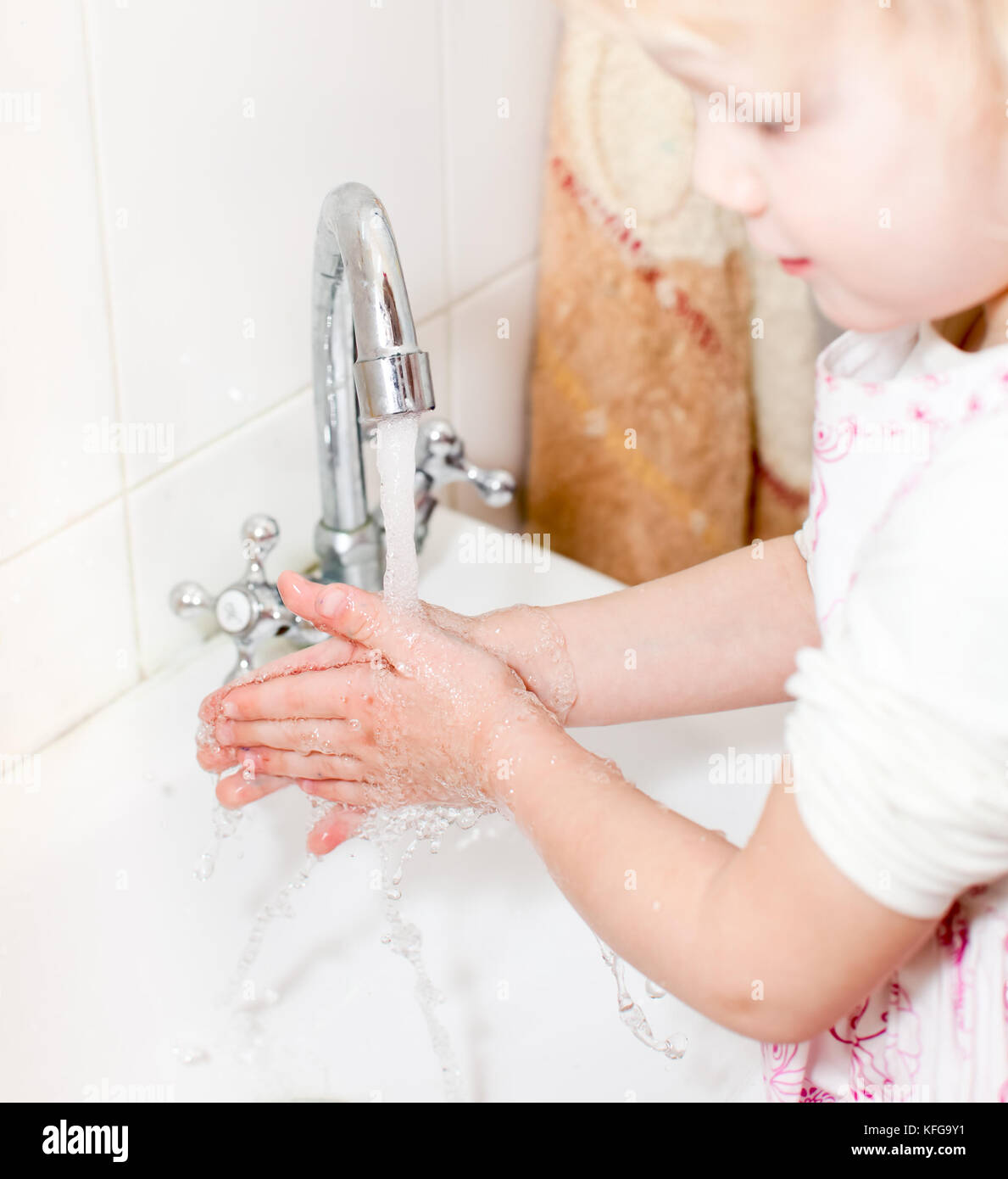 Little girl washing her hands in bathroom, shallow focus Stock Photo ...