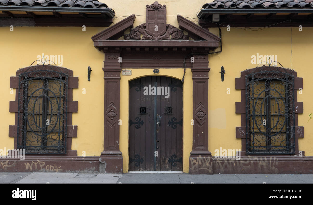 Very Old Yellow Building With Brown Window And Door Details And