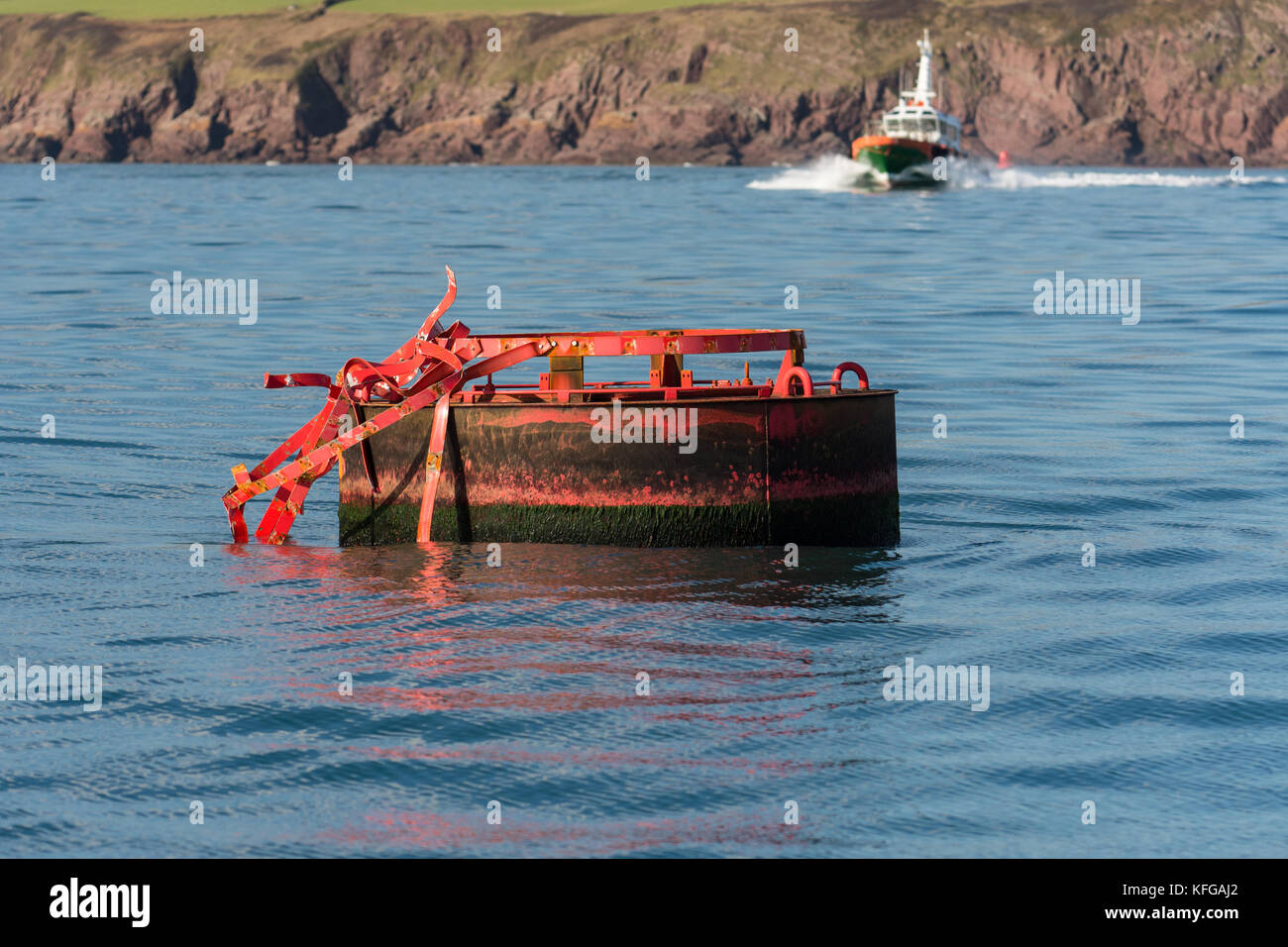 Navigation marker damaged by storms in Milford Haven entrance Stock Photo