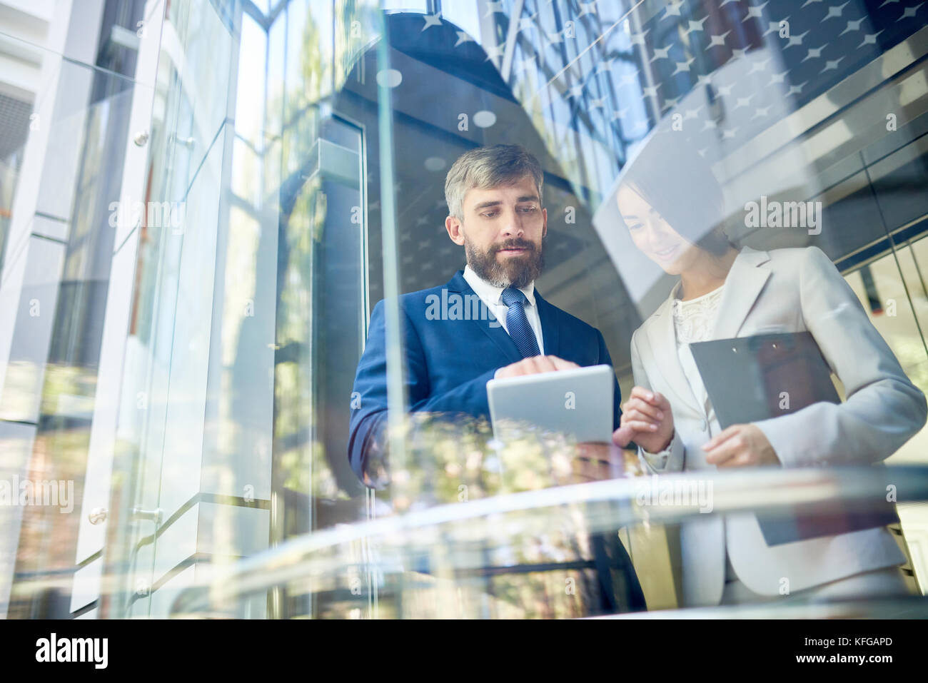 Successful Business People Behind Glass Stock Photo