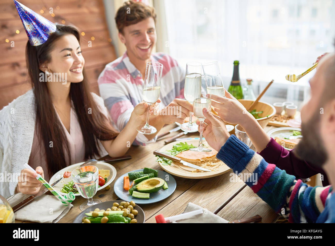 Happy Asian Woman Celebrating Birthday with Friends Stock Photo