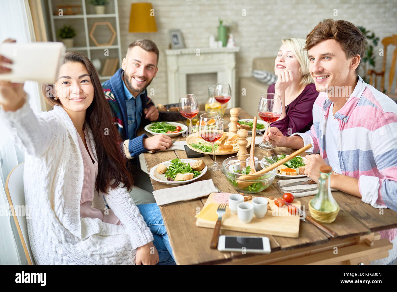 Friends Taking Selfie at Dinner Table Stock Photo - Alamy