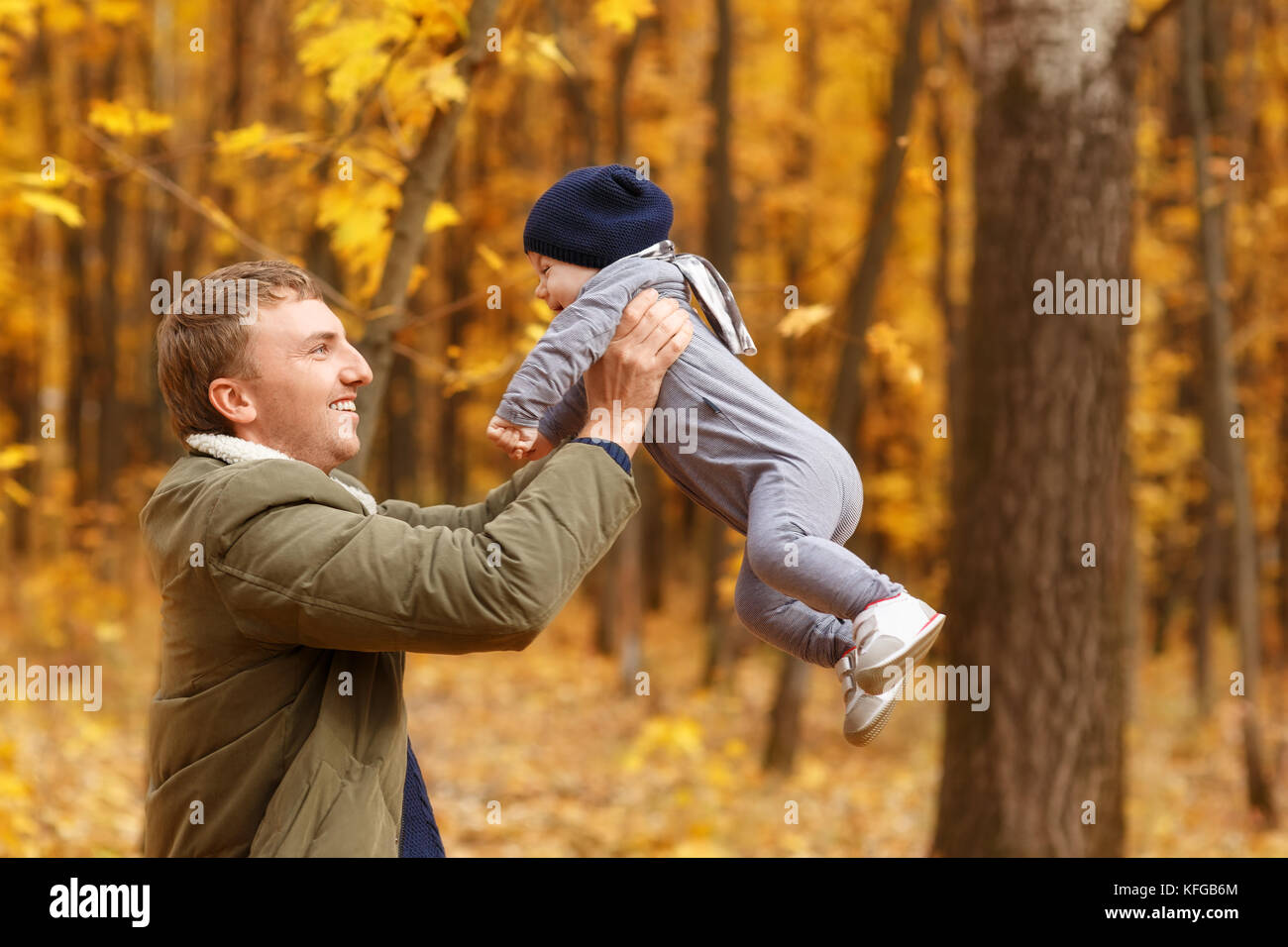 dad holding baby girl in hands Stock Photo