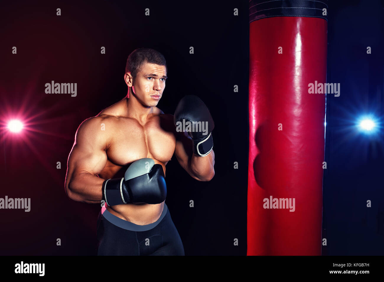 man boxing punching bag Stock Photo