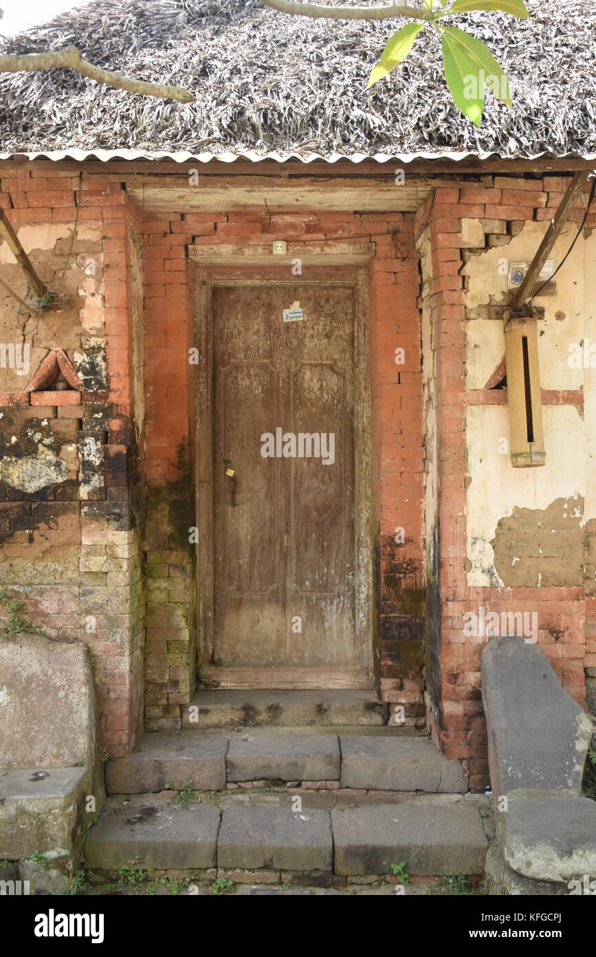 Old wooden door of an house inside Tenganan Aga aboriginal village in Bali, Indonesia Stock Photo