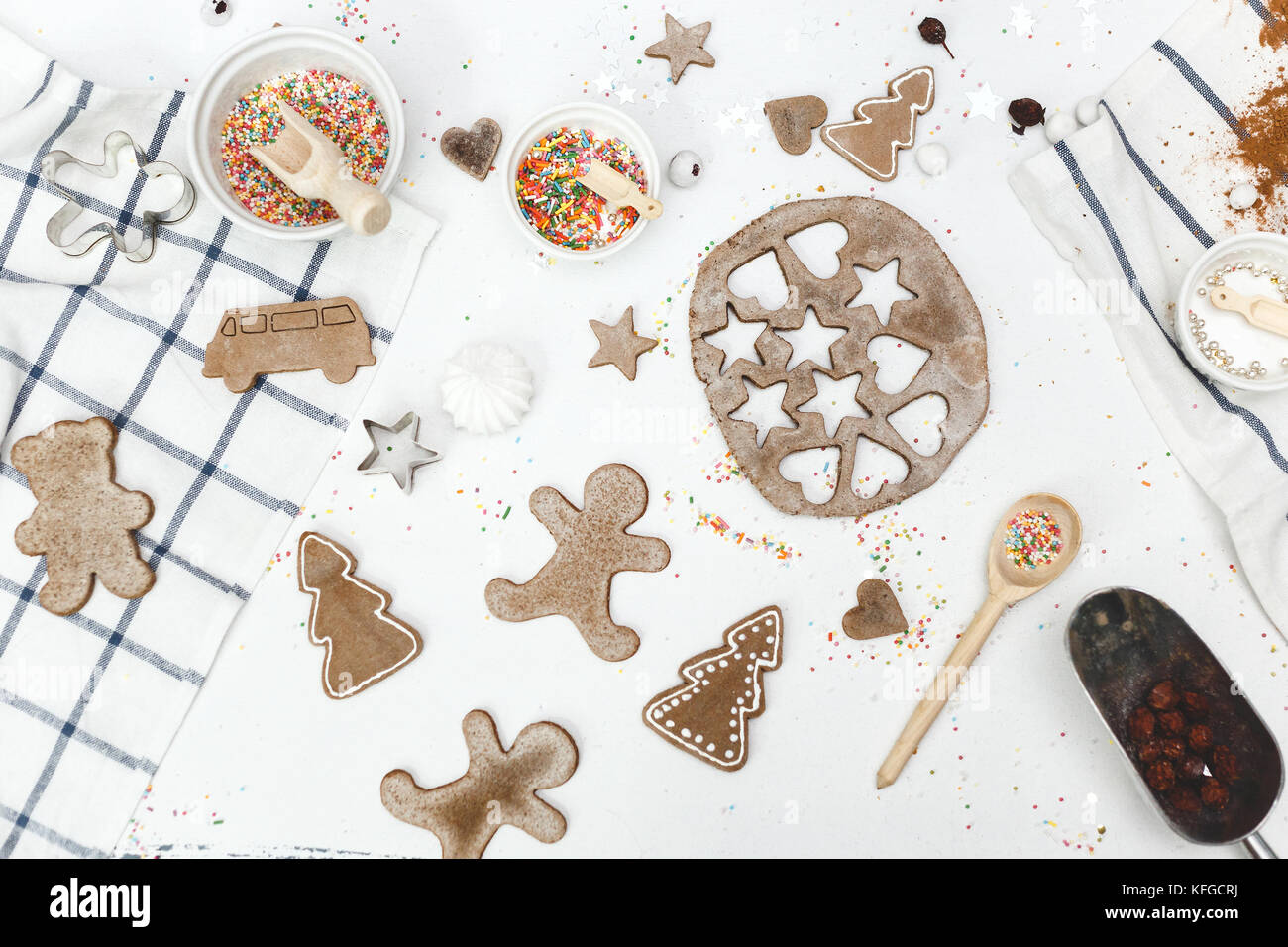 Fresh baked gingerbread cookies in christmas festive shapes on baking tray  in modern white kitchen Stock Photo by Sonyachny