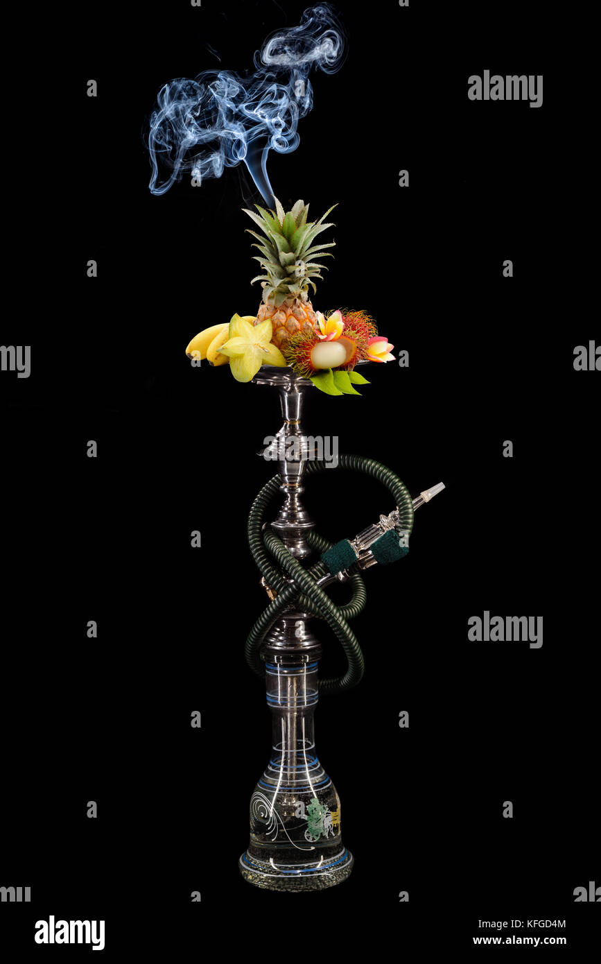 Smoking hookah with fruit head on dark background Stock Photo Alamy