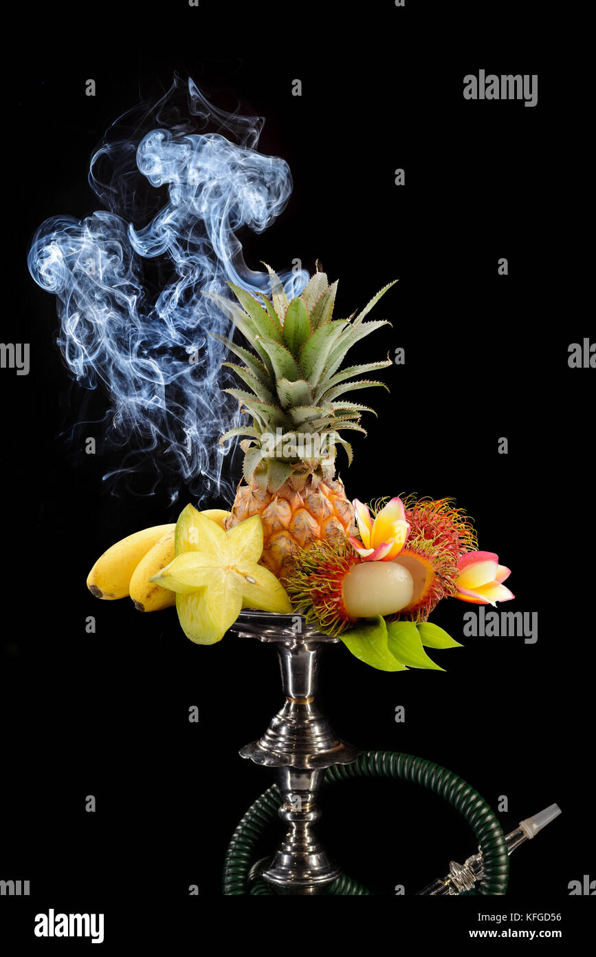 Smoking hookah with fruit head on dark background Stock Photo Alamy