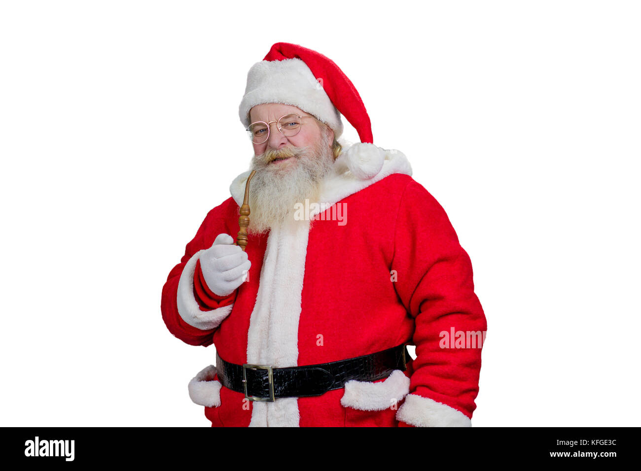 Realistic Santa Claus smoking his pipe. Studio shot of bearded Santa
