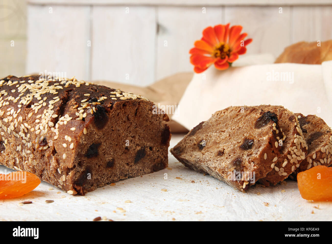 Loaf and slices of rye unleavened bread without yeast with dried