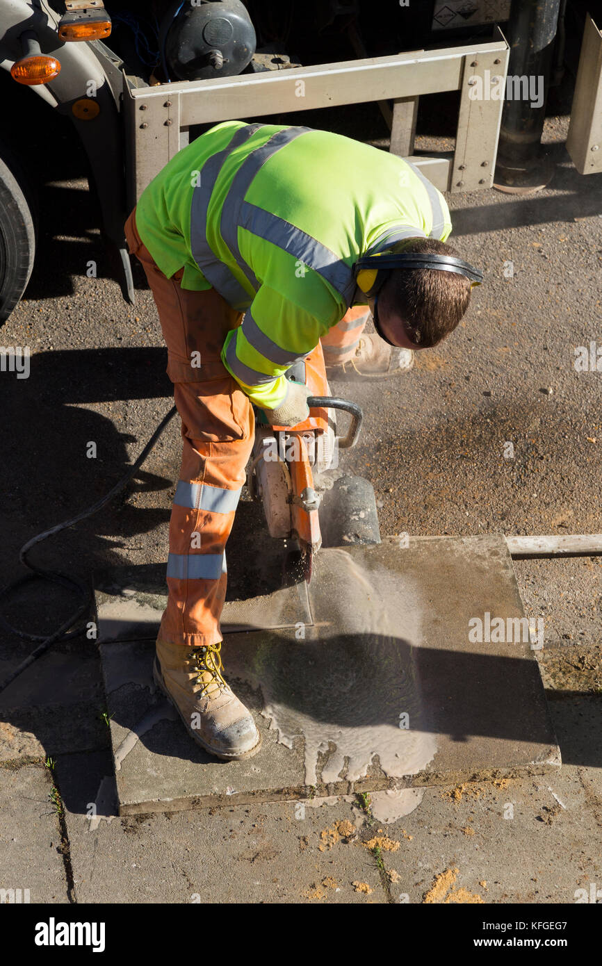 Team of lighting contractors reinstate pavement and cut concrete slabs