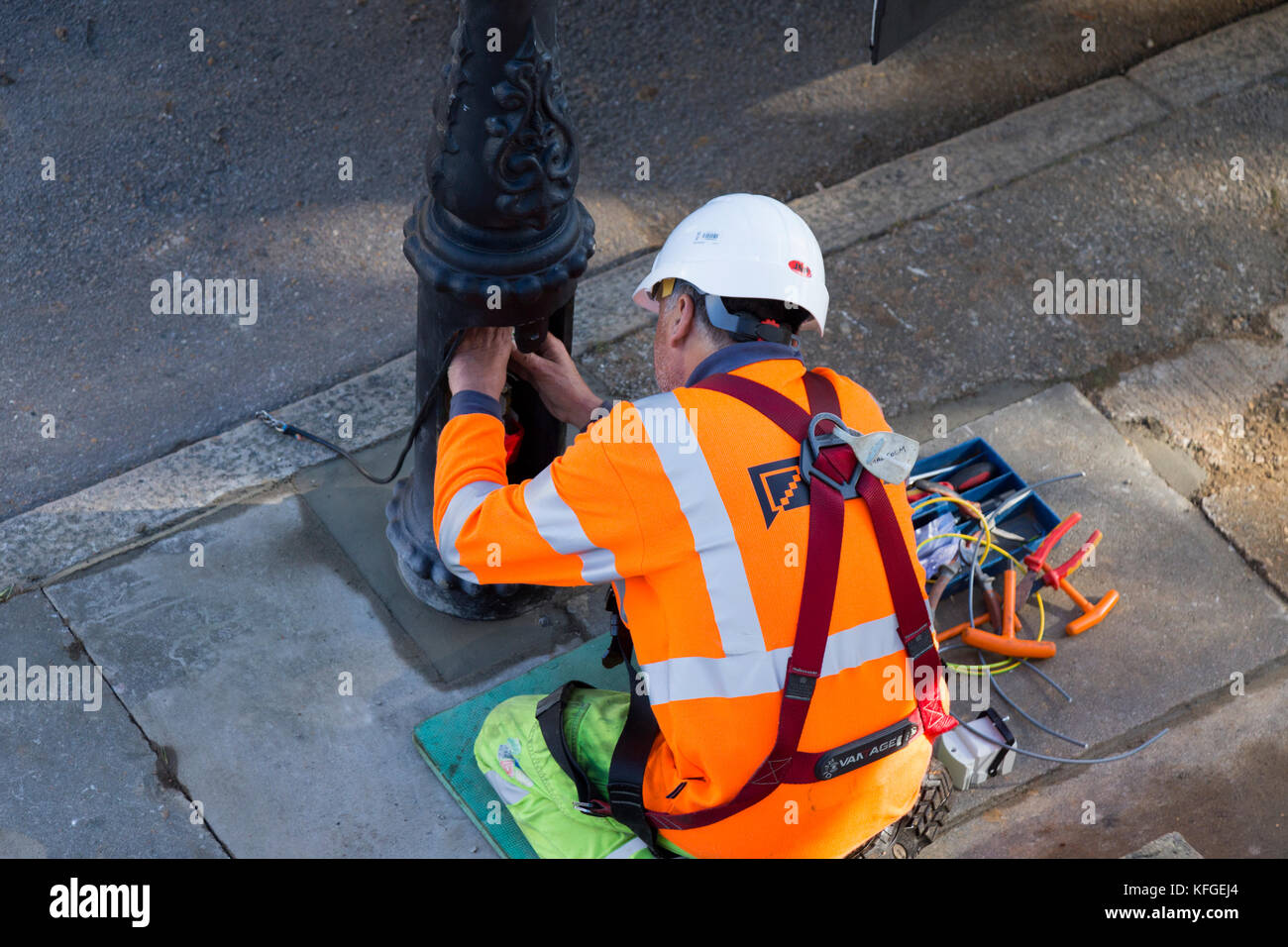 Team of lighting contractors fitting a Heritage street lamp / street