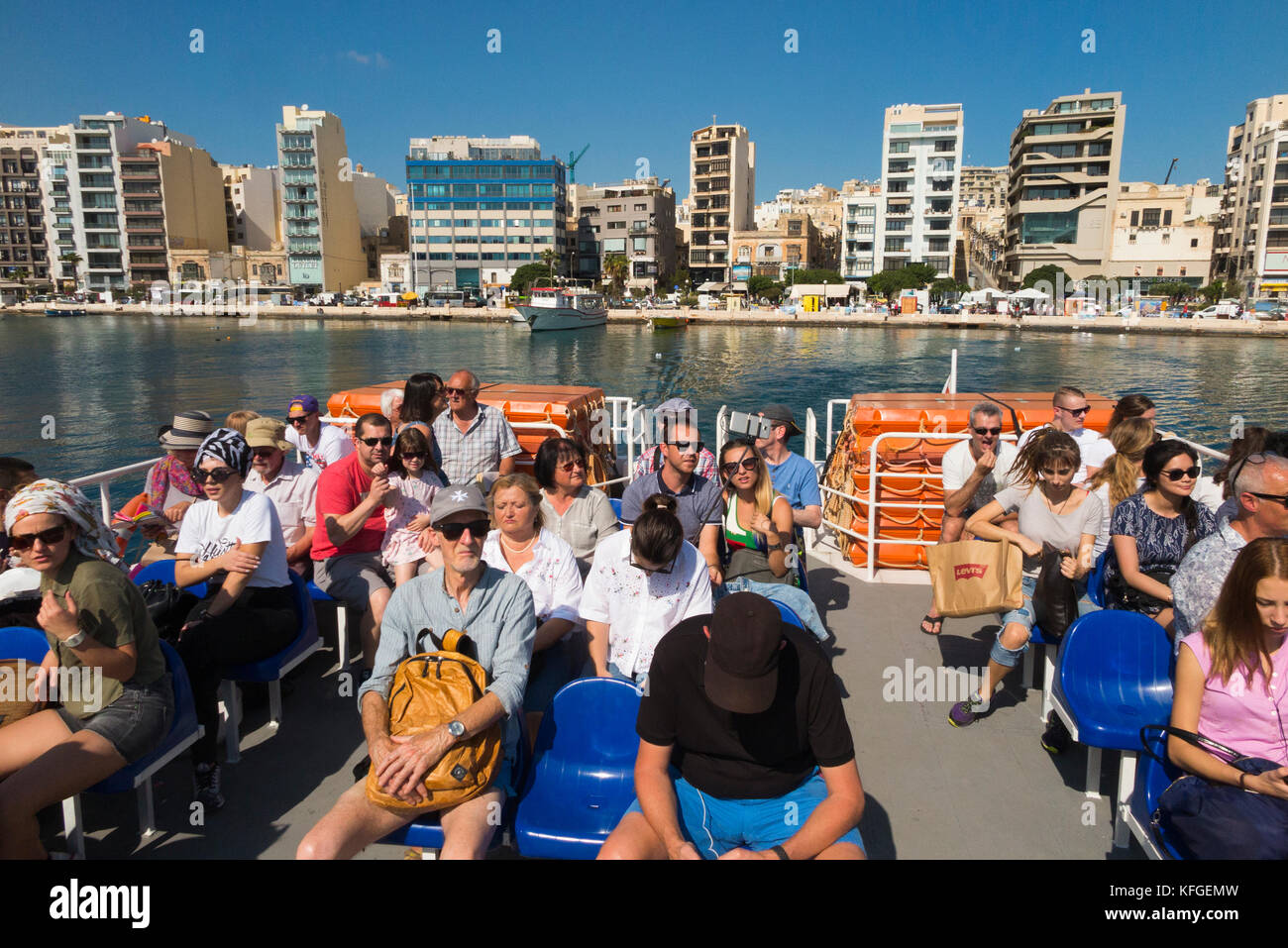 The Valletta / Sliema passenger Ferry ' Top Cat One ' with the Sliema skyline in the background. Malta. (91) Stock Photo