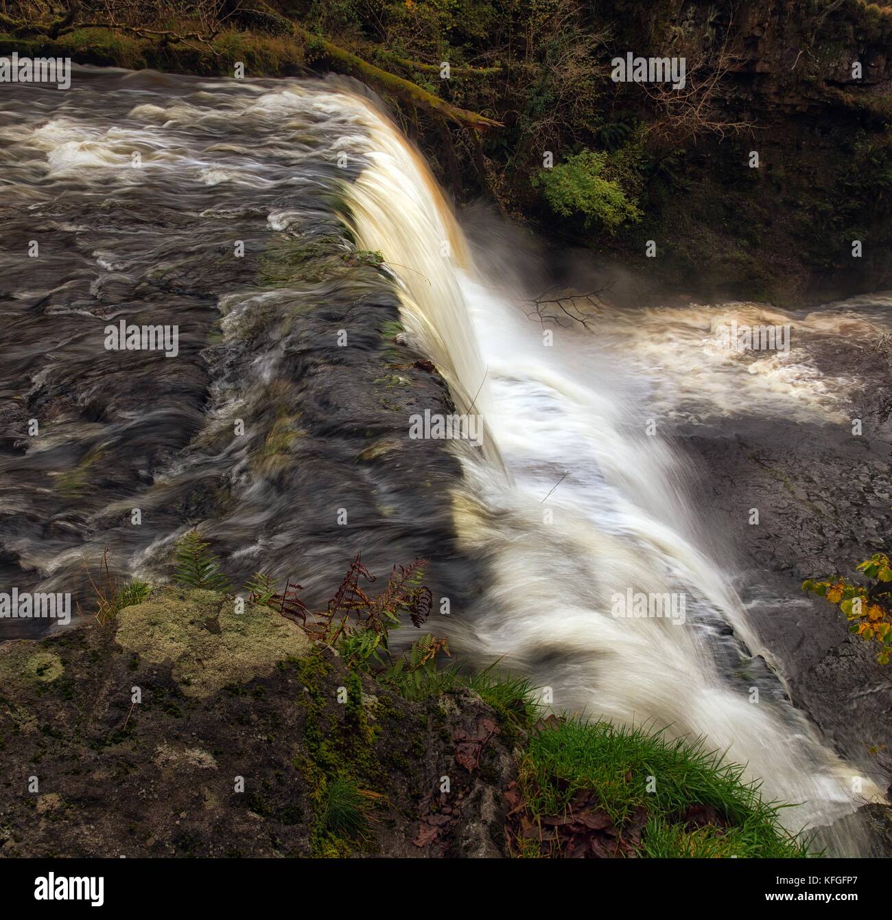 Cascading water at Sgwd Clun Gwyn waterfall Stock Photo
