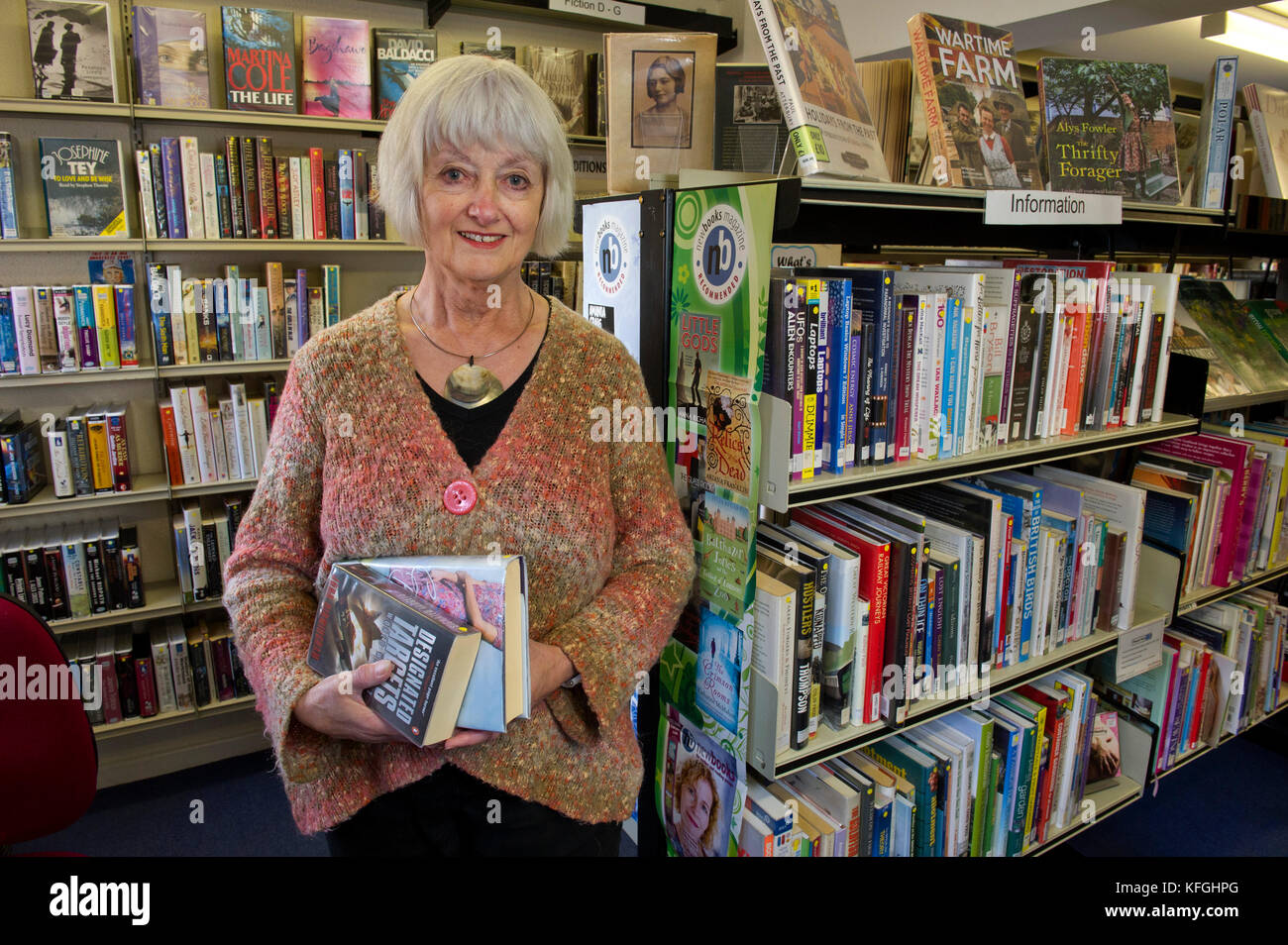 Mary Cook volunteering in Ramsbury Library Stock Photo - Alamy