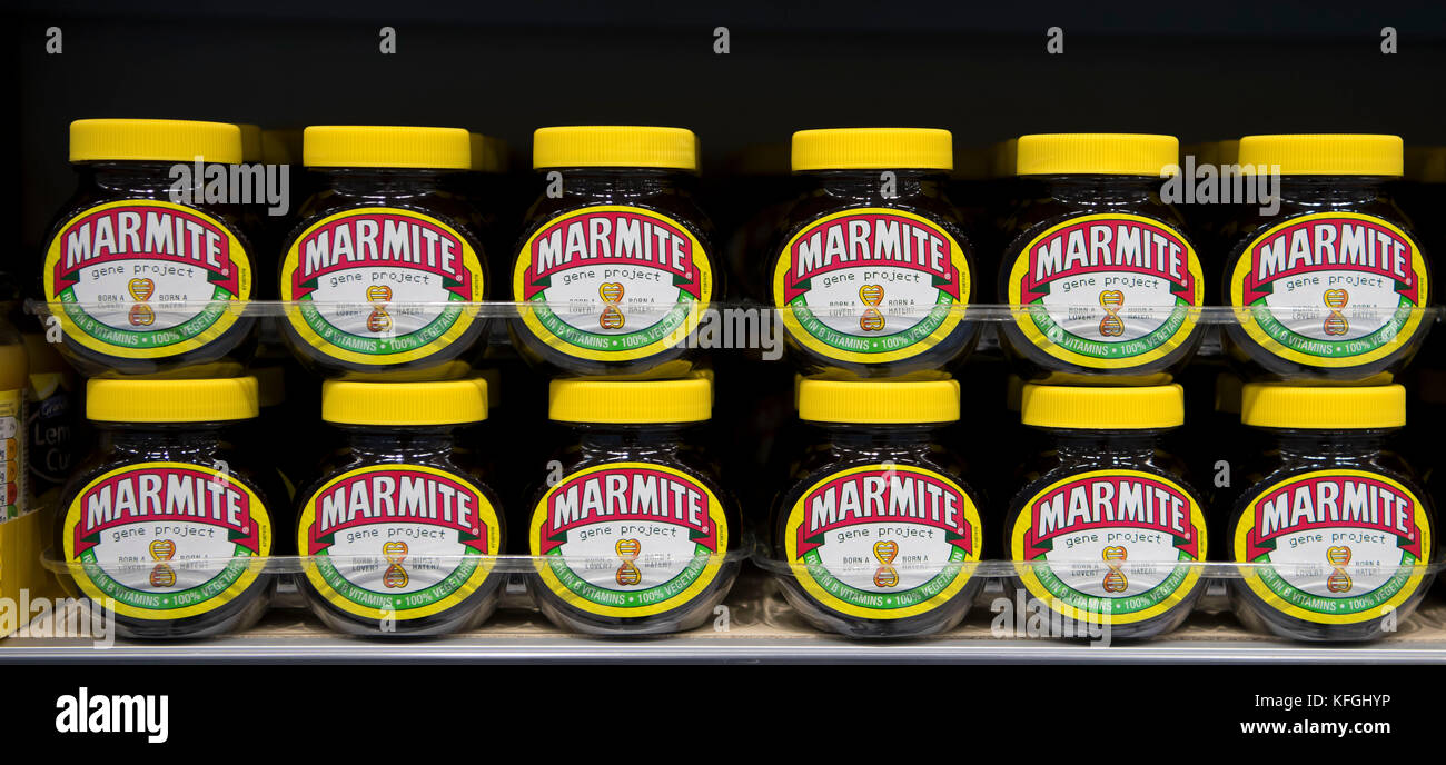 Multiple jars of marmite on sale on display on a supermarket shelf in a