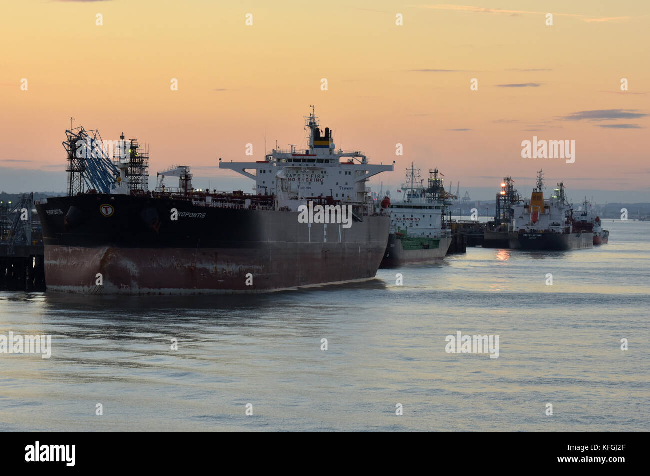 Very large oil tankers and gas ships alongside at the marine terminal at fawley refinery on the edge of southampton water offloading crude oil. Stock Photo