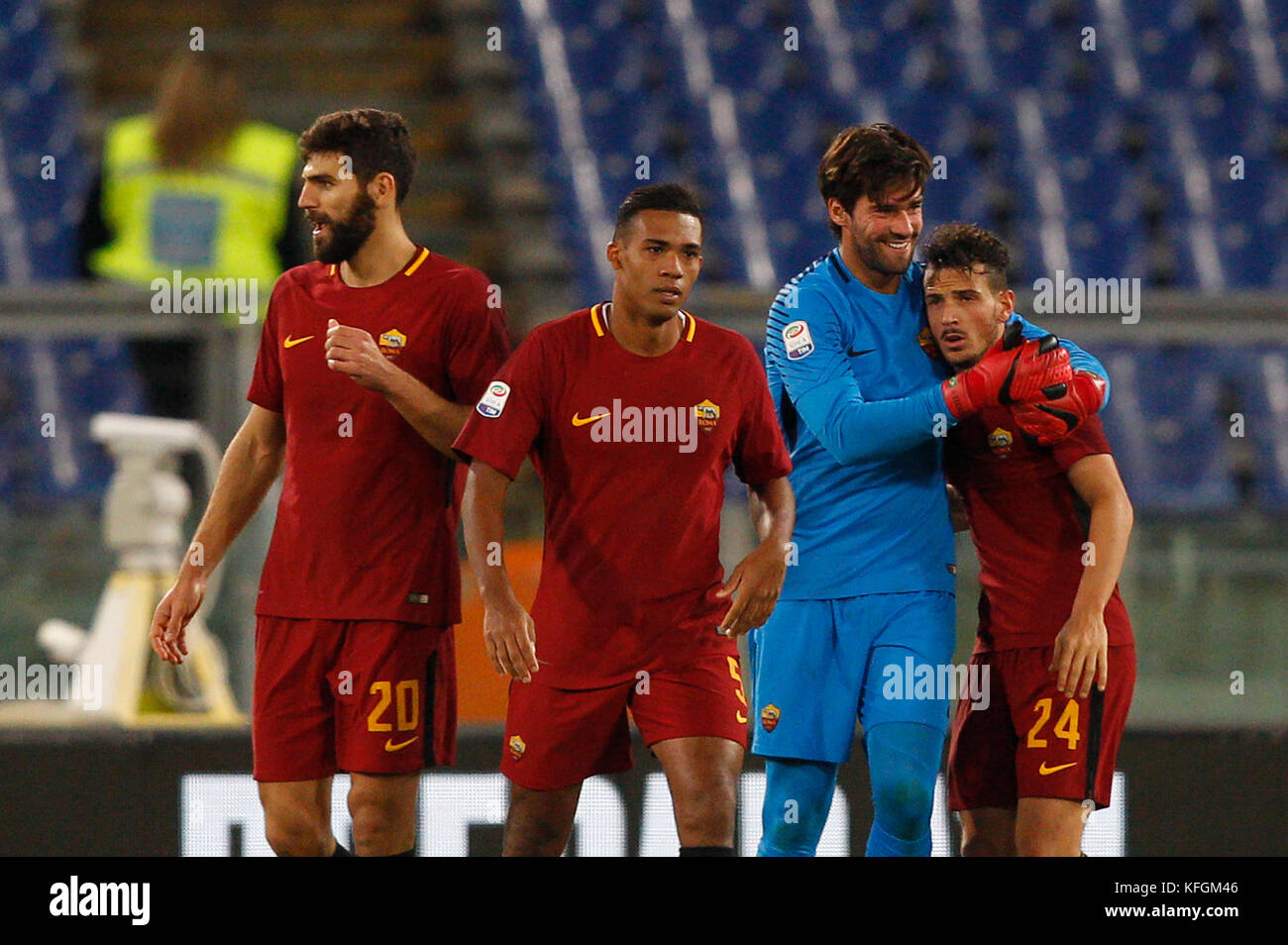 From left, Roma s Federico Fazio, Juan Jesus, Alisson Becker and Alessandro Florenzi celebrate at the end of the Serie A soccer match between Roma and Bologna at the Olympic stadium. Roma won 1-0. (Photo by Riccardo De Luca / Pacific Press) Stock Photo