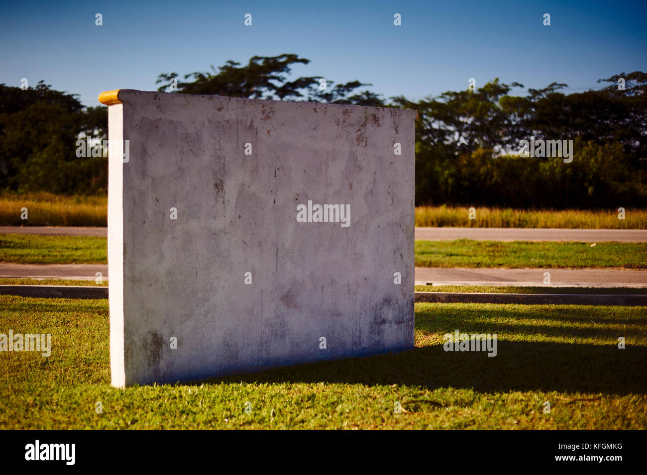 Monolithic concrete stone outdoors with blank space Stock Photo