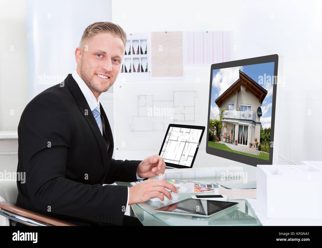Businessman or estate agent checking a property portfolio online while