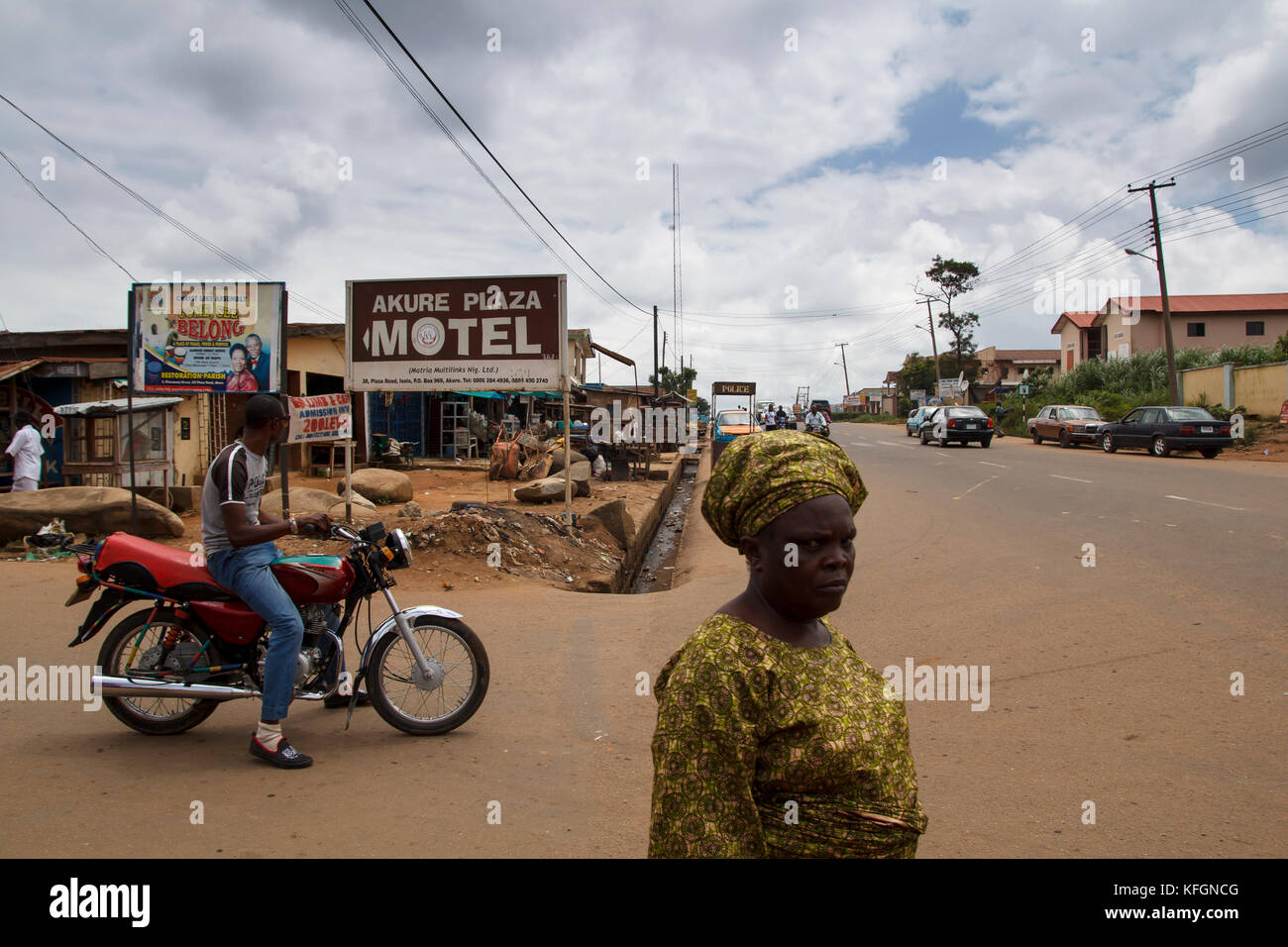 Nigerian man and woman in local dress in the street in the city of Akure in Ondo state, Nigeria Stock Photo
