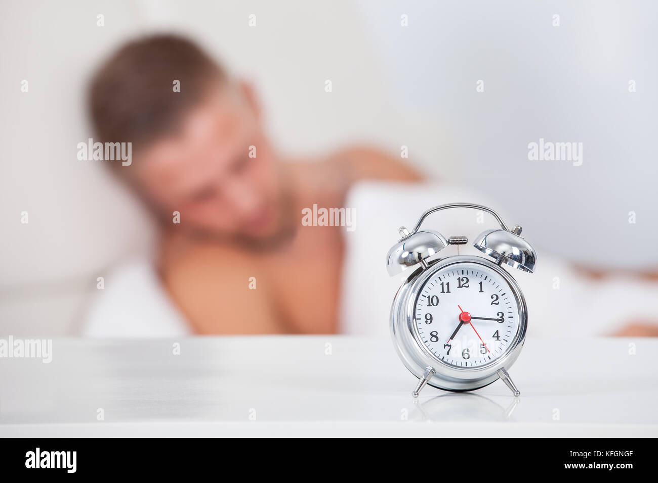 Alarm clock about to ring in the morning showing a quarter past seven