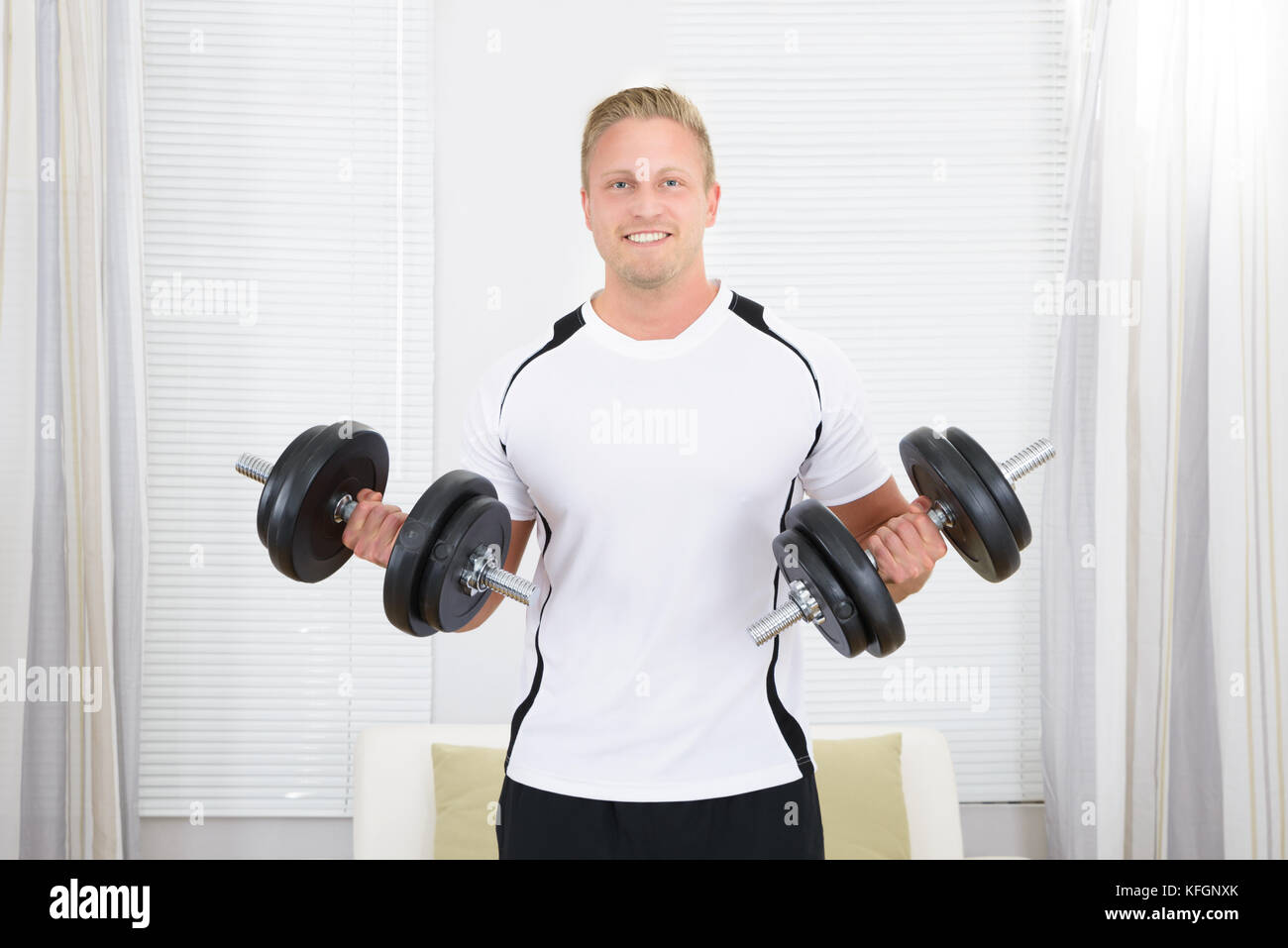Portrait Of Happy Healthy Man Lifting Weights Stock Photo Alamy