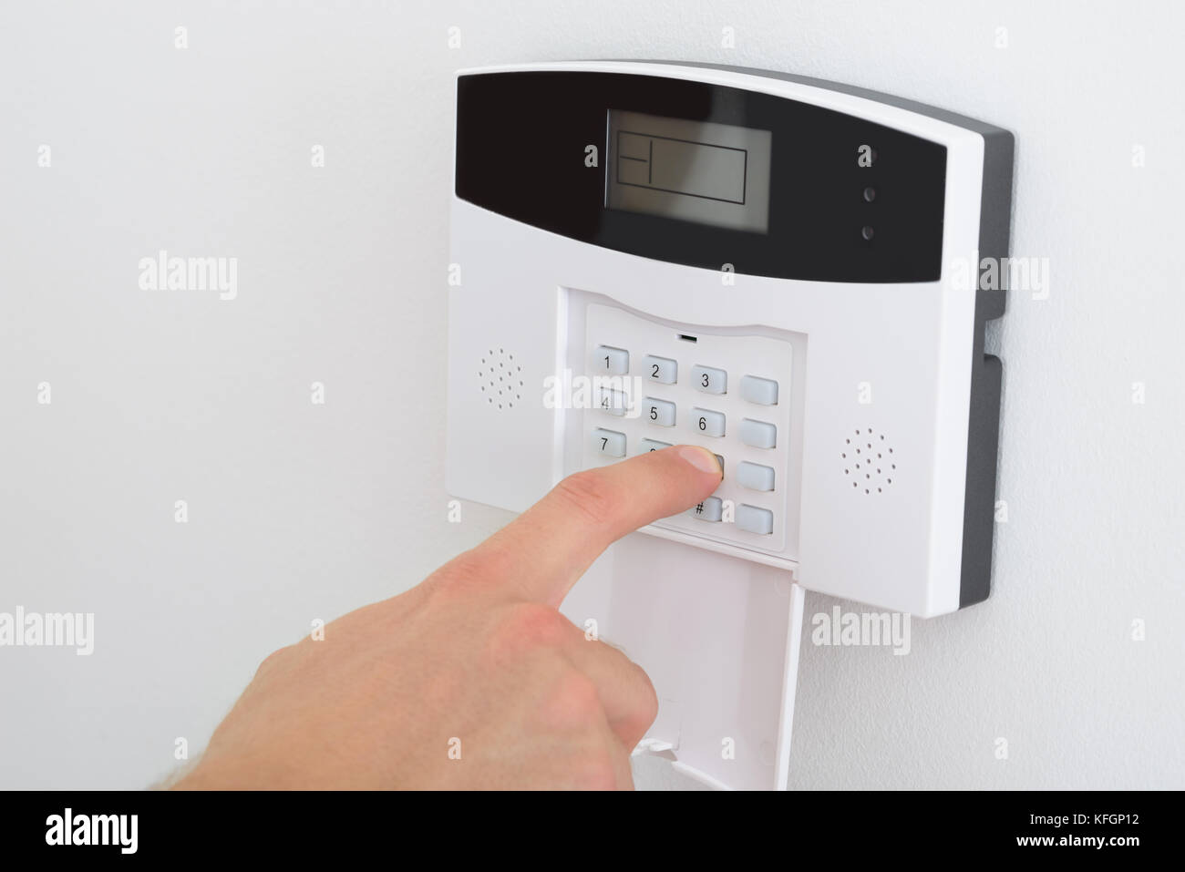 Security Alarm Keypad With Person Arming The System Stock Photo Alamy