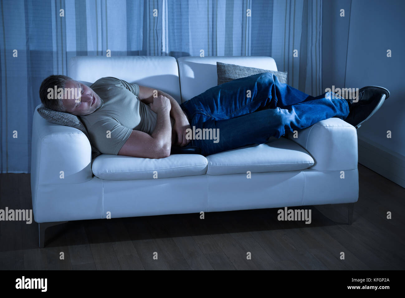 Portrait Of A Young Man Sleeping On Couch Stock Photo Alamy
