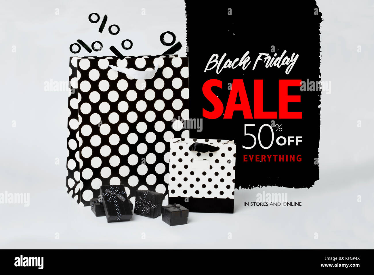 Small, black gift-boxes with black and white gift-bags with polka dots