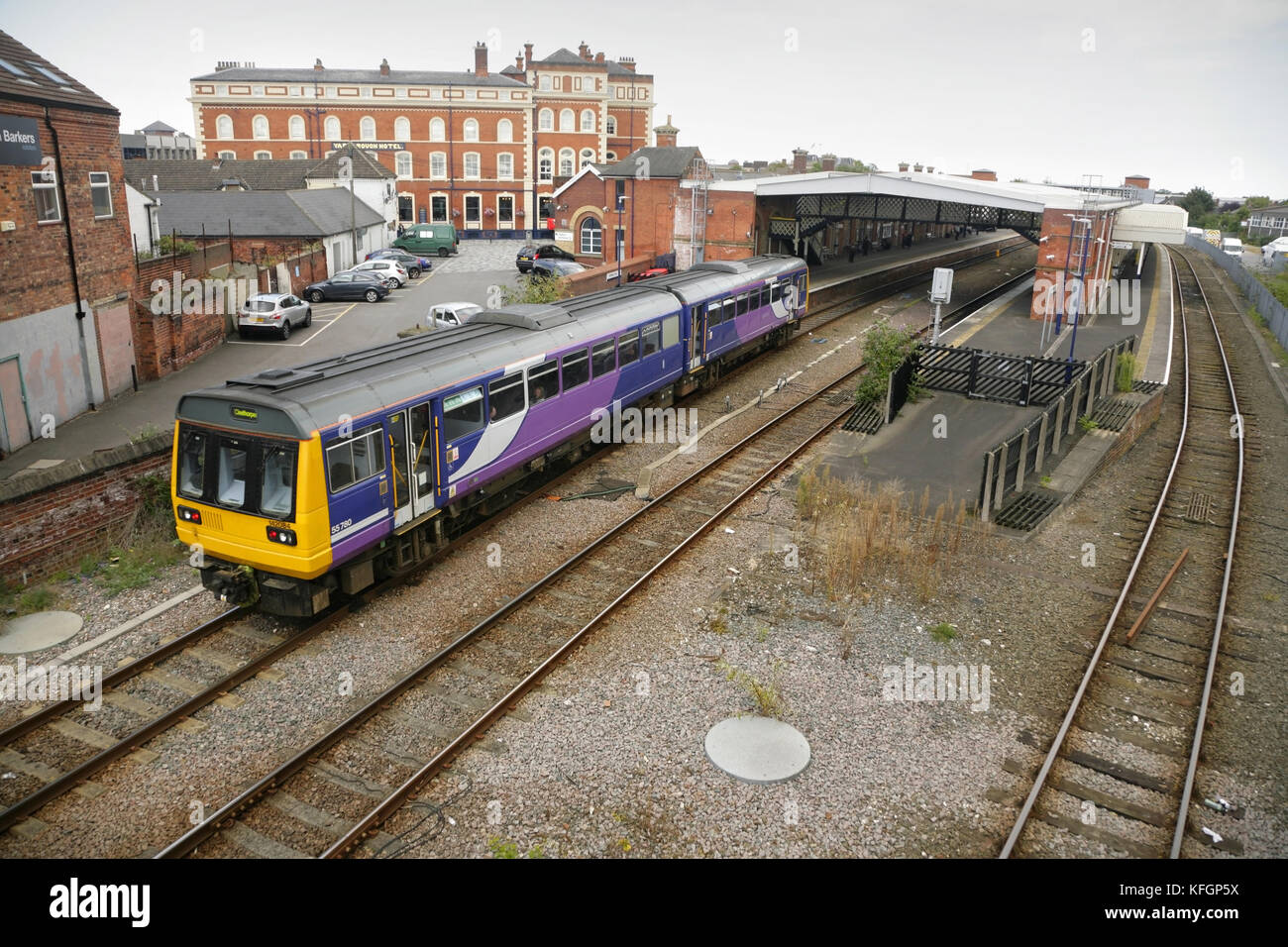 Northern Rail class 142 diesel multiple unit arriving at Grimsby Town station, UK with the Yarborough Hotel behind. Stock Photo