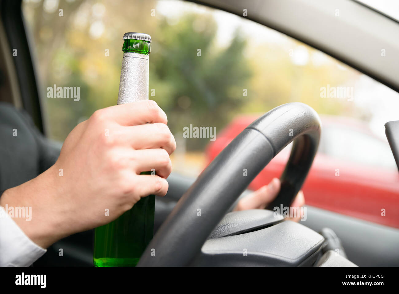 Close-up Of A Man's Hand In Car Holding Beer Bottle While Driving Stock ...