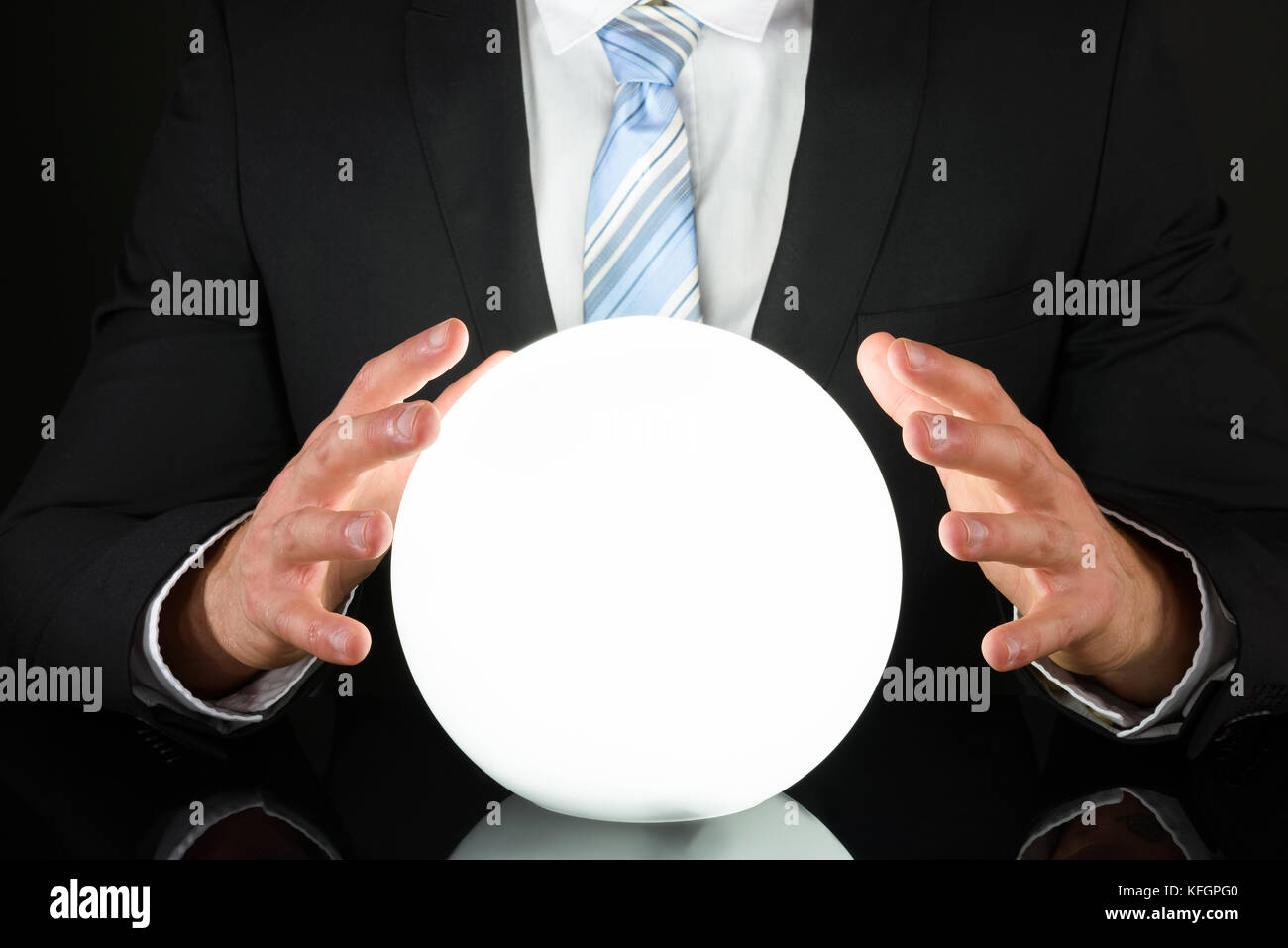 Close-up Of Businessman Hand On Crystal Ball Stock Photo - Alamy