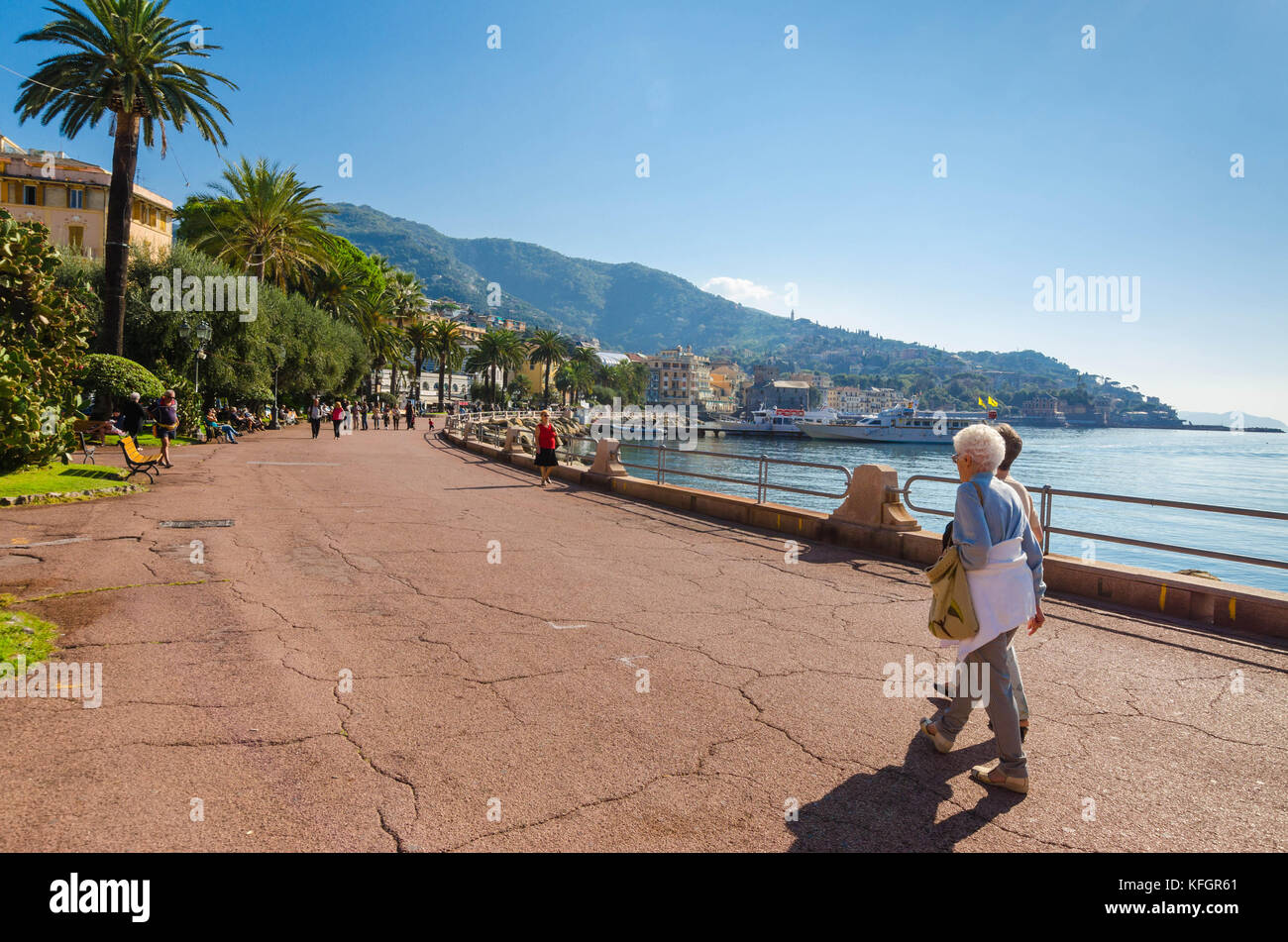 Tourists aimlessly strolling along the promenade in Rapallo Italy Stock Photo