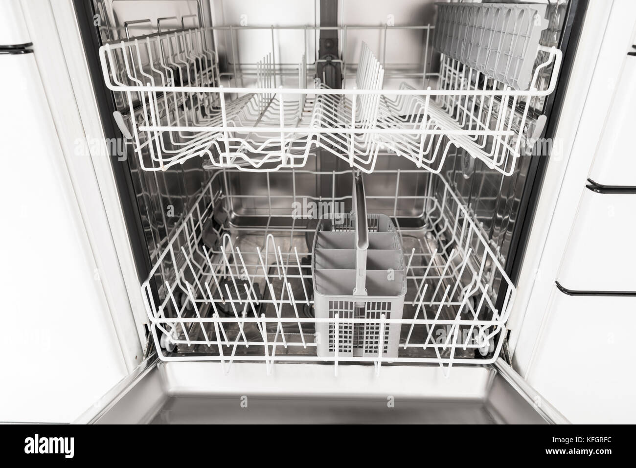 Closeup Photo Of An Empty Opened Dishwasher Stock Photo Alamy