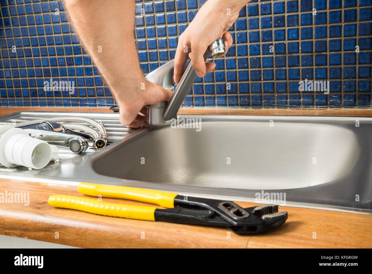 Closeup Of Plumber's Hand Fixing Tap Of Sink Stock Photo Alamy