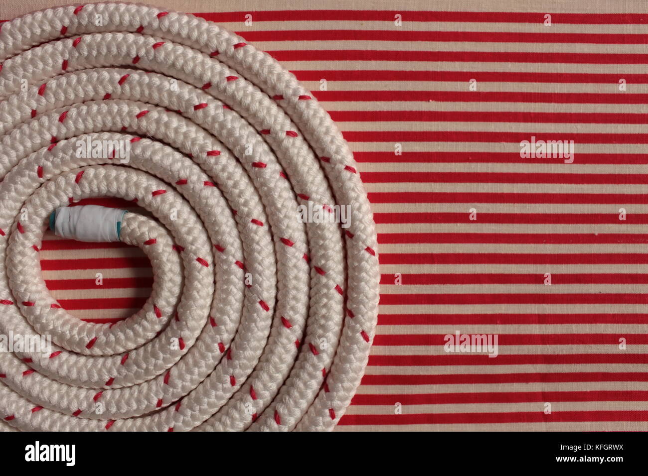 Rope round spiral red striped flat lay background Stock Photo