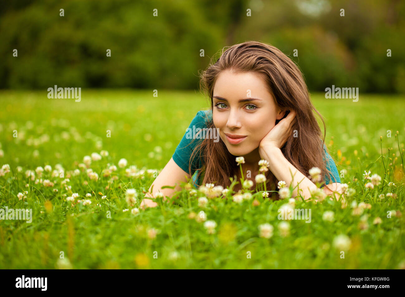 Gorgeous young pretty brunette woman relaxing in summer park Stock ...