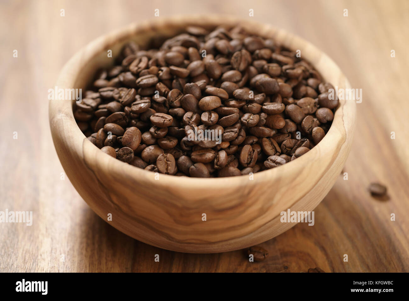 roasted coffee beans in wood bowl on table, shallow focus Stock Photo ...
