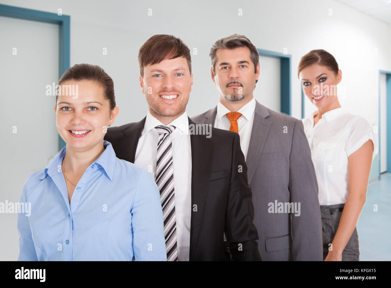 Portrait of confident businesspeople standing together in office Stock Photo