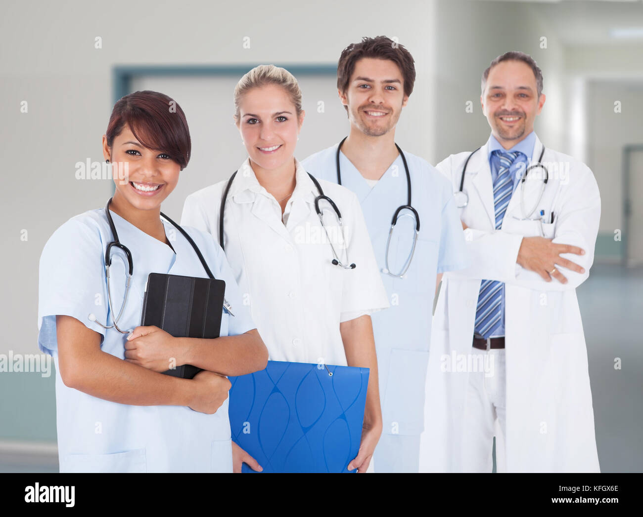 Portrait of multiethnic doctors with stethoscopes around neck standing